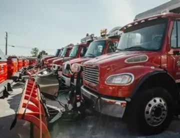 Our versatile dump trucks can provide snow removal and ice control service any size parking lot.